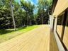 Sliding doors from LR open to this 52 foot long deck, which runs the length of the house.