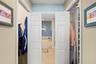 Primary en-suite closet to bathroom entry hall