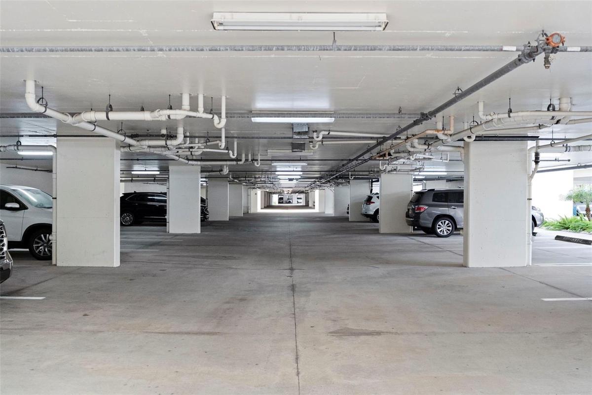 Under Building assigned parking ( mailboxes, recycling , lobby with cart for residents to use , and doors leading to pool area