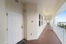 Front door entry, views of community parking and adjacent waterfront homes
