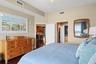 Master en-suite facing door to living room and hallway to walk in closets and primary  bath