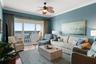 Living room with 12x8 storm hurricane grade sliders to balcony