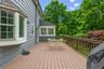 Large deck overlooks the beautifully landscaped back yard.