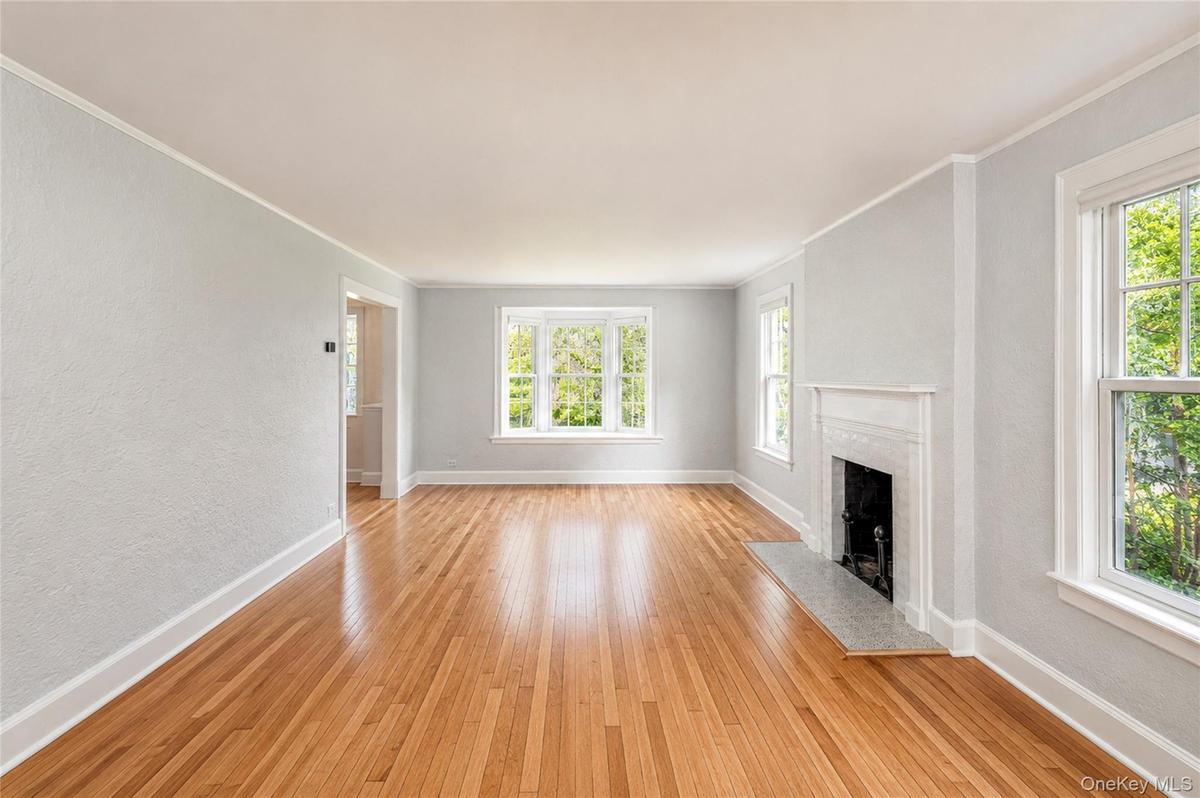 Living Room w/ wood burning fireplace.