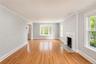 Living Room w/ wood burning fireplace.