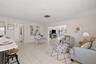Enter into the kitchen, den and dining areas