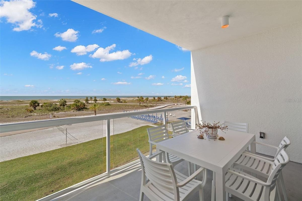 This fully furnished, turnkey 2-bedroom, 2-bath coastal retreat features marble flooring throughout the main living area, full-size in-unit washer/dry