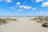 opportunity to own a newer, income-producing, direct Gulf-front unit in one of Treasure Island’s most desirable beachfront developments.