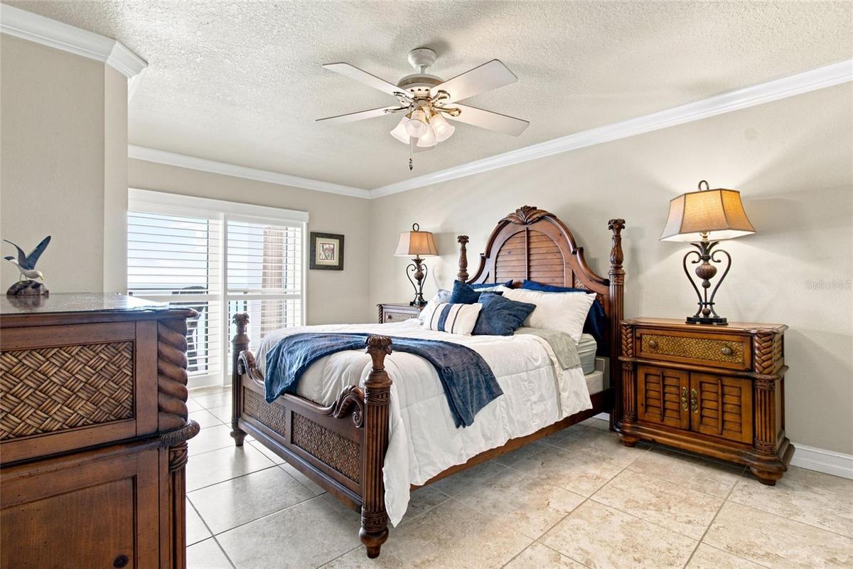 Primary Bedroom with hurricane sliders to patio and gulf views
