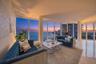Spacious living area with panoramic waterfront views.