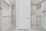 Spacious closet with generous storage.