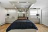 Recessed lighting accentuates the tray ceiling with a built-in ceiling fan