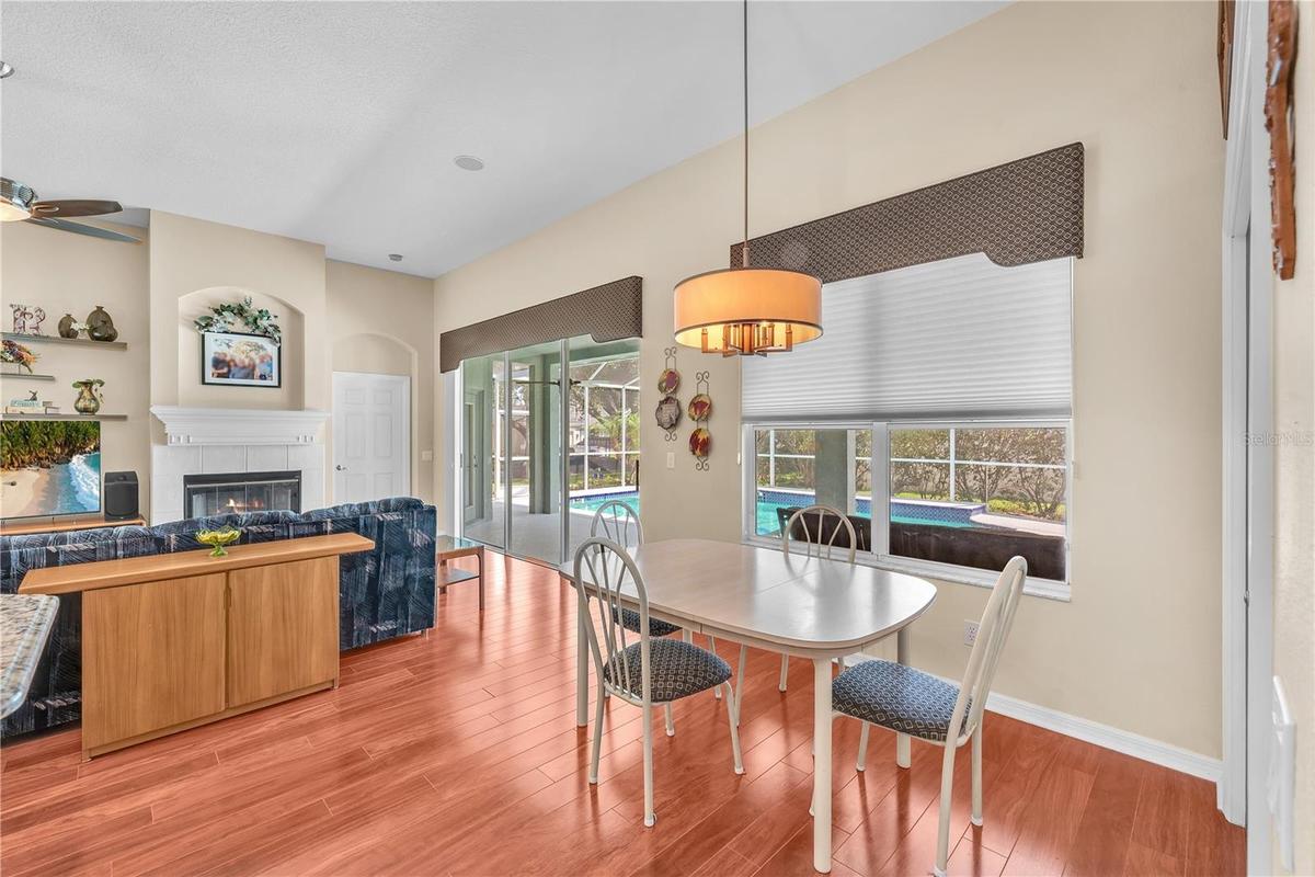 There is a spacious breakfast nook overlooking the pool where family and friends naturally gather.