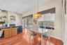 There is a spacious breakfast nook overlooking the pool where family and friends naturally gather.
