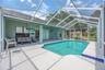 Oversized screened pool and covered patio and lanai.