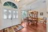 Just inside the front doors is the dining room with crown, chair rail and picture frame moldings.
