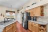 Black stainless steel appliances, granite counters, quartz granite composite sink with double basin, loads of work space and double closet door pantry