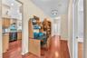 Three additional bedrooms are thoughtfully situated on the opposite side of the home, creating a private wing ideal for family and guests including a 