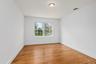 One of the additional bedrooms with hardwood floor