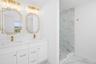 This custom design bathroom in a previously built  home with gold color accented tiling and accessories. All subject to change