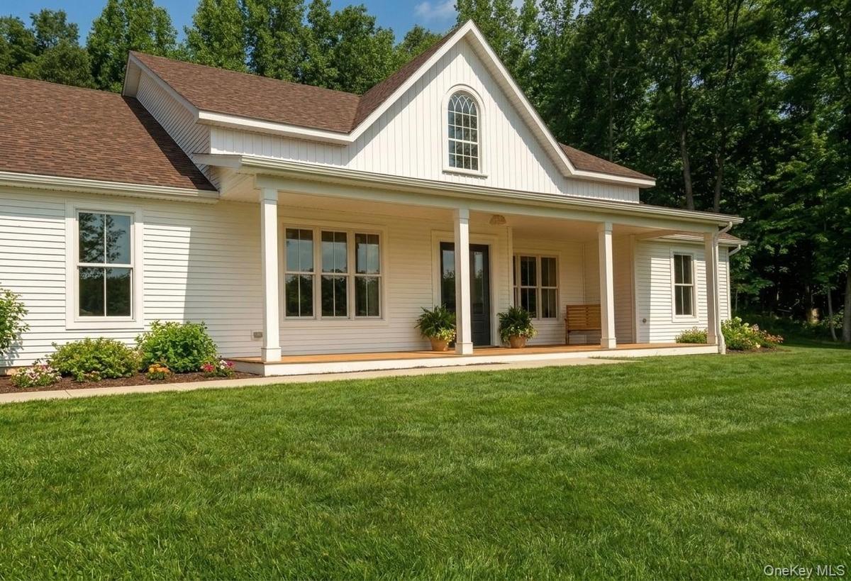 Depicts previously built farmhouse with same builders. Front porch will be changed to more maintenance free materials. All subject to change