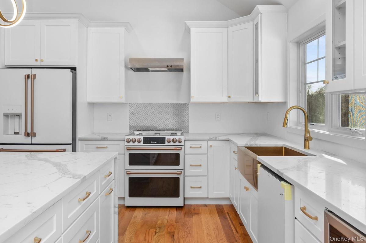 Photos shows one of the designs used by builders on a previously completed home. Appliances shown resulted in increased costs to buyers beyond listed 