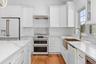 Photos shows one of the designs used by builders on a previously completed home. Appliances shown resulted in increased costs to buyers beyond listed 