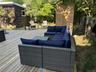 Wooden deck featuring outdoor lounge area