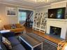 Living room featuring wood finished floors and bookcase