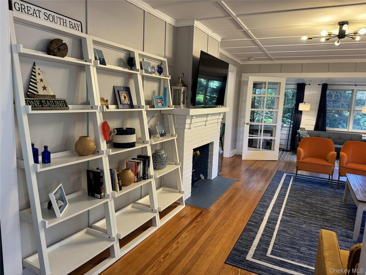Living room featuring wood finished floors and bookcase