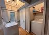 Washroom featuring washer / dryer and light wood-style floors