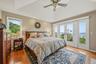 Primary Bedroom with Fireplace, Balcony, Walk-in Closet & Renovated Bath