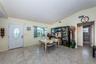 Living and dining room with access to the guest bathroom and 2 bedrooms.