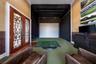 Office den space fitted for a golf simulator
