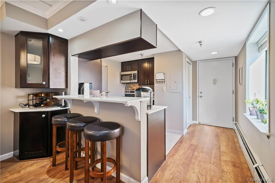 Entry Hall & Kitchen View With Eat-in Counter