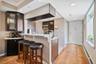 Entry Hall & Kitchen View With Eat-in Counter