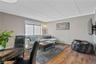 Another View Of the Living Room With Large Windows For Natural Light (Has Been Freshly Painted)