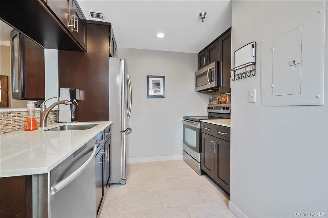 Kitchen Has Stainless Steel Appliances & Lots Of Storage
