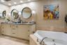 Primary BA w/ marble from floor to ceiling