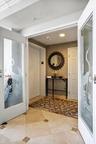 Private foyer entry w/ French doors to main living area