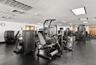 Gym adjacent to pool deck, sauna, steamroom & cabana baths