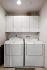 Separate laundry RM w/ full side by side Washer & Dryer