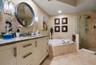 Primary BA w/ fossilized stone double vanity counertop, Jacuzzi tub & separate walk-in shower