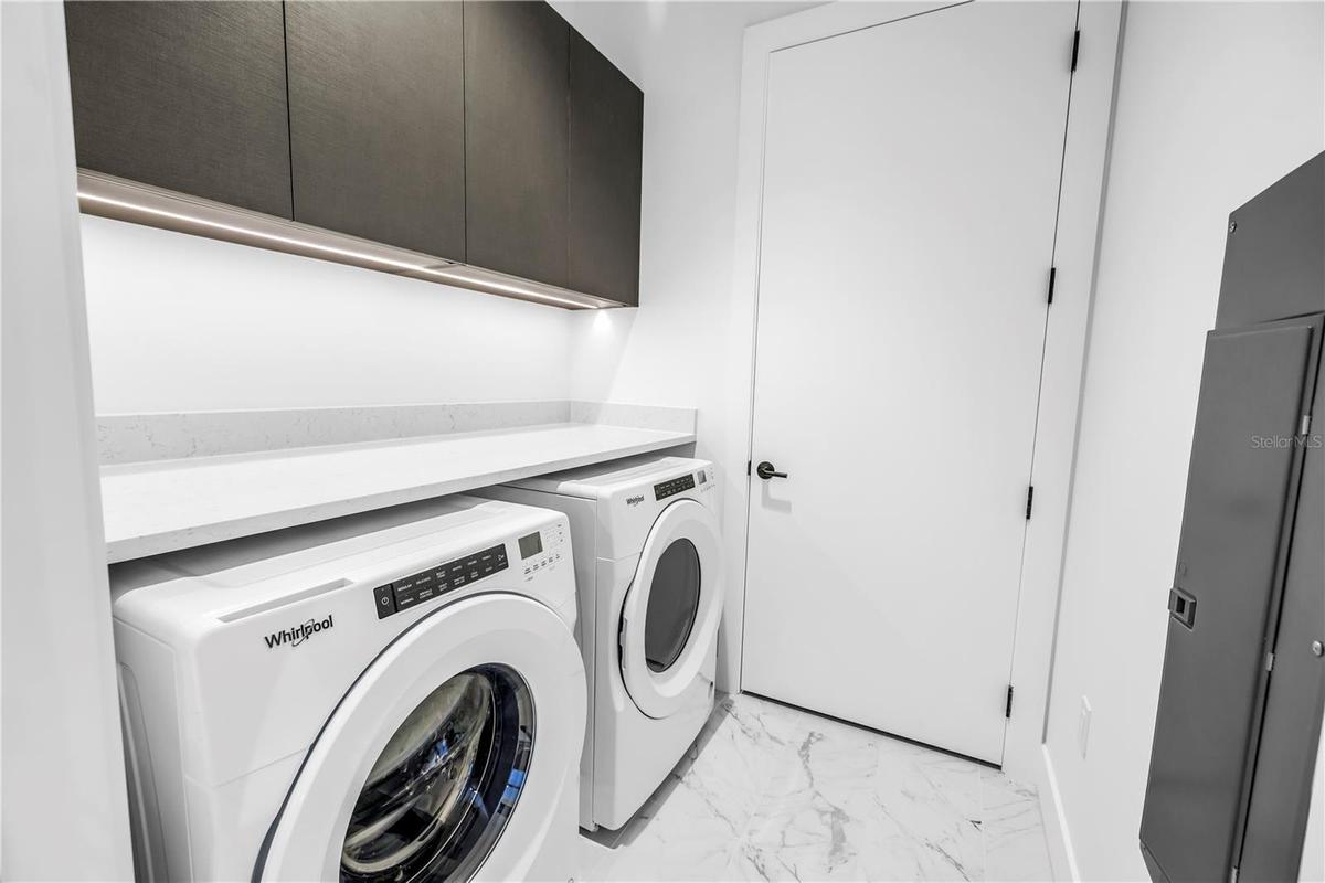 Laundry room with Whirlpool washer and dryer