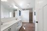 Walk-in shower and dual vanity in primary