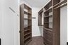 Cabinetry and organization in primary bedroom