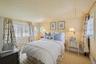 Bedroom with baseboards and carpet floors