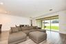 Triple sliding glass doors filling the home with natural light.