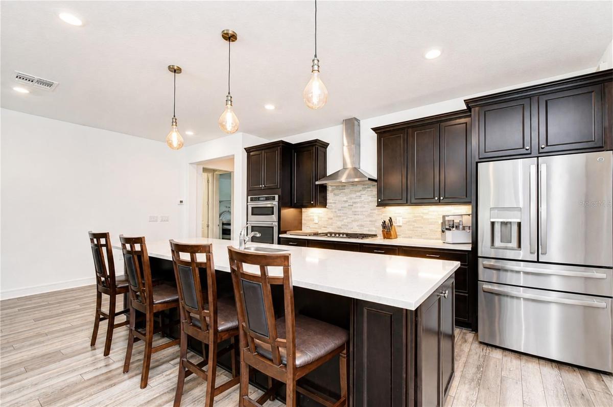 Beautifully appointed kitchen overlooking the great room and dining area.