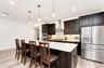 Beautifully appointed kitchen overlooking the great room and dining area.